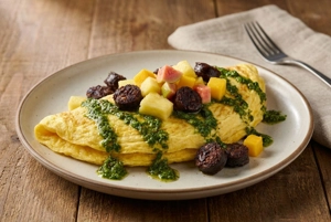 Omelette with Chimichurri, Pineapple, Mango, Guava, and Morcilla