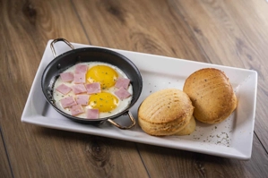 BONO BREAD AND EGGS IN A SKILLET WITH HAM
